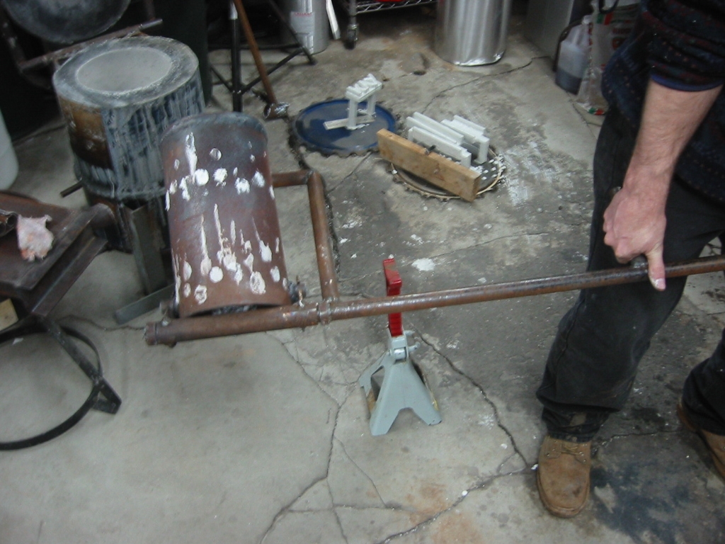 Crucible tilted for pouring.