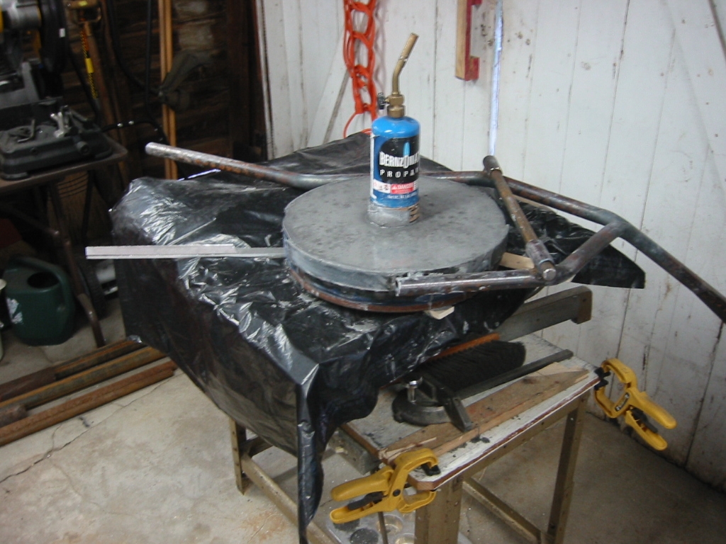 Mizzou Castable Refractory poured in and vibrated by the table saw underneath.