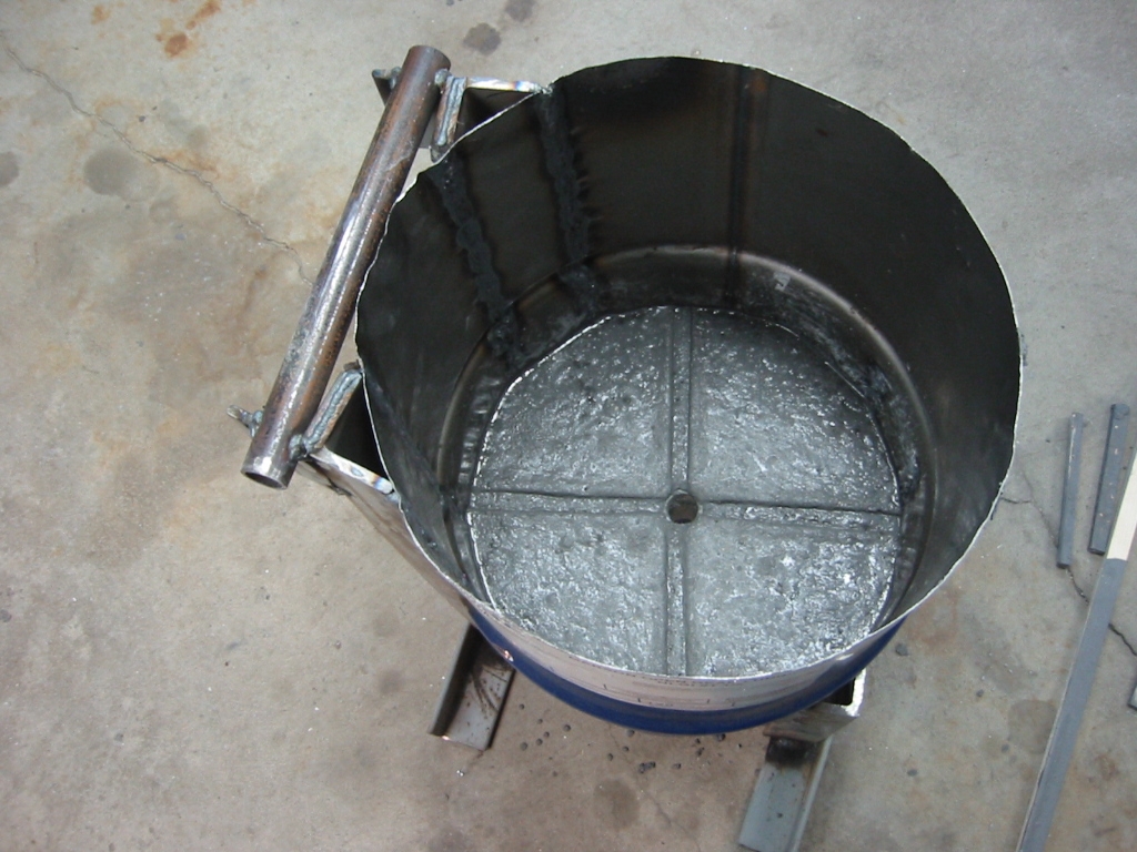 Mizzou poured 3 inches deep into the bottom, with a hole left to drain the metal should the crucible fail.