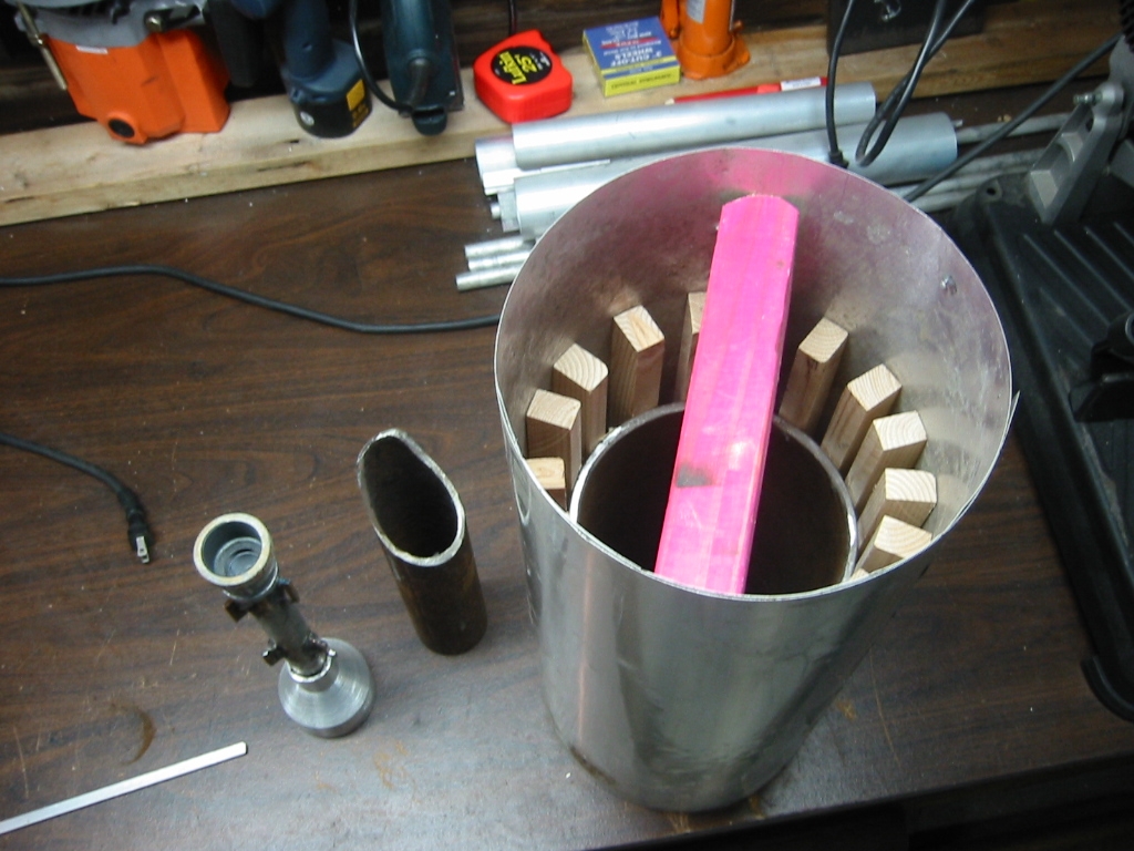 Inside form made by wrapping flashing around wood furring strips that are glued to the steel crucible.