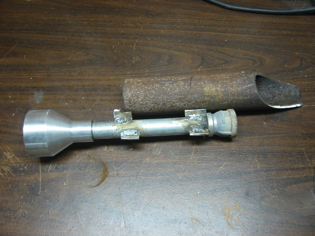Steel pipe for the burner. It is shaped to fit up against the inside form around the crucible.
